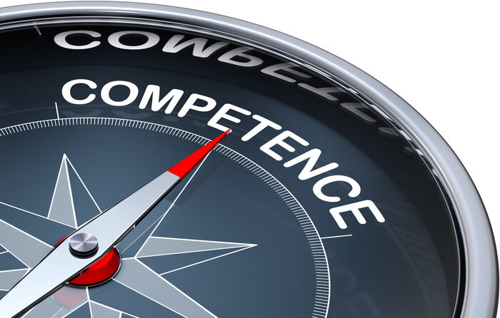A compass pointing to the word competence